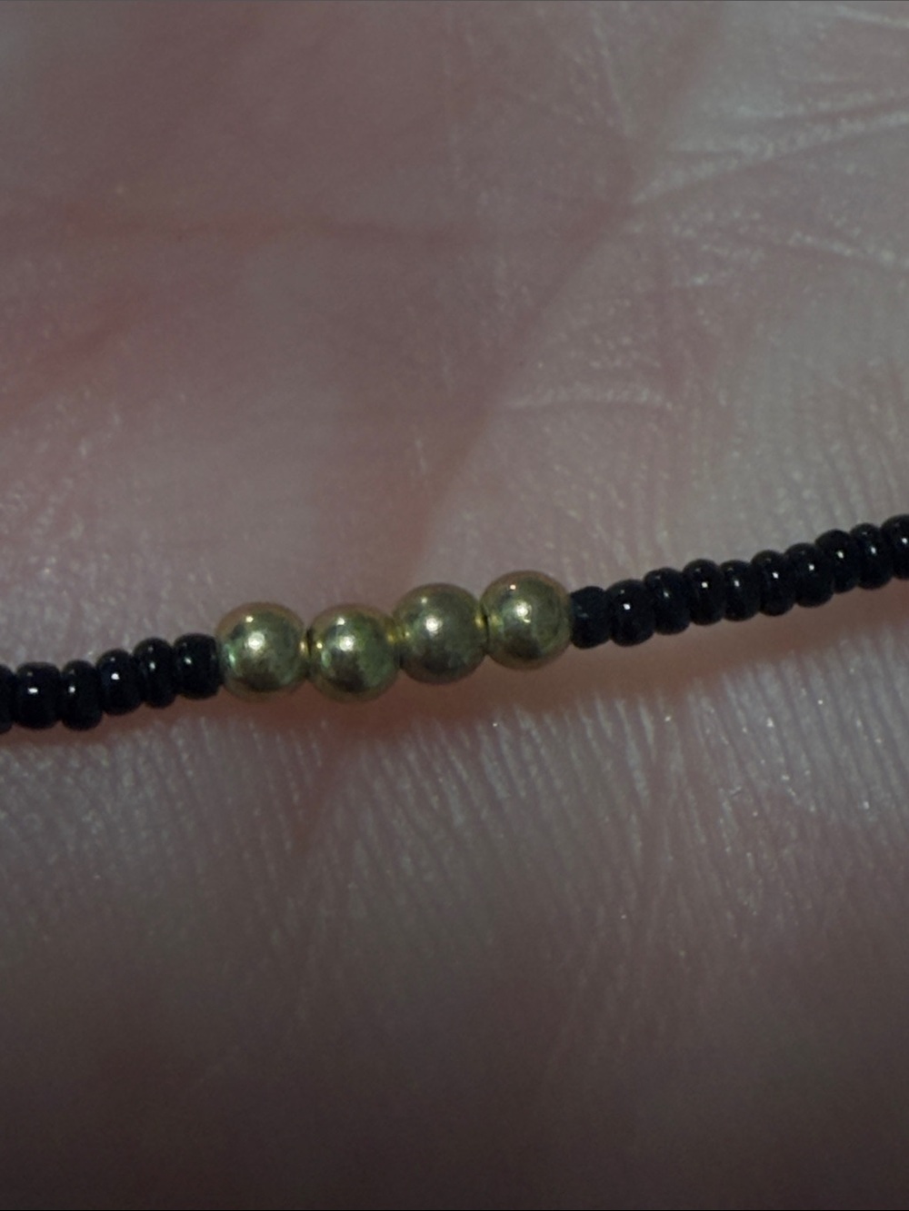 Elegant Black Beaded Layered Necklace with Gold Accents - Picture 6 of 8